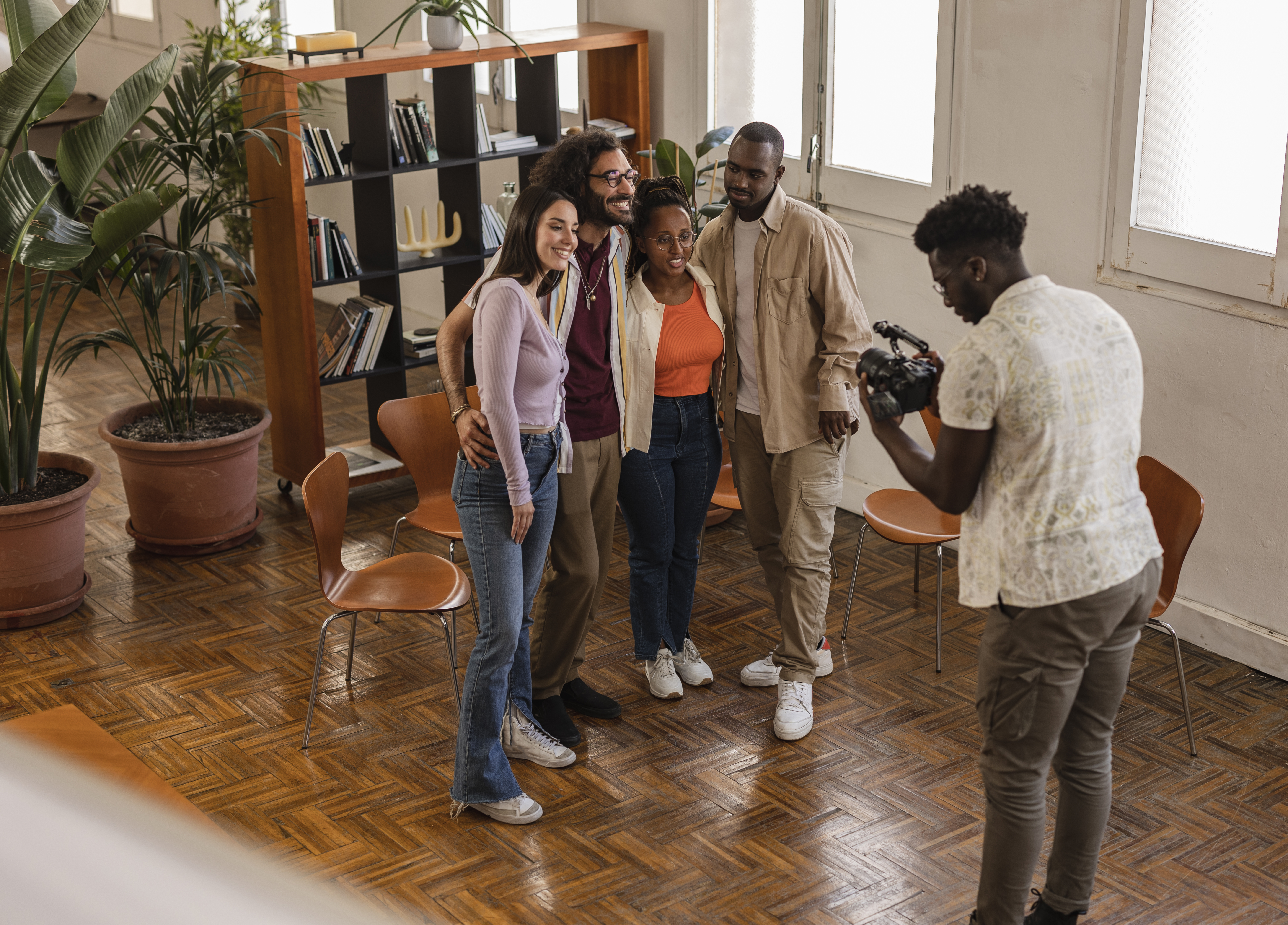 group of diverse workers in coworking, they are shooting a promotional video photographer videographer blog